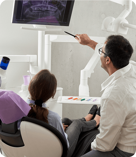 Dentist reviewing scans with a patient